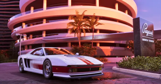 A white Grotti Cheetah sports car outside a Vice City hotel
