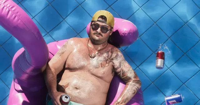 A Leonida local floating in a pool with a can, official GTA VI artwork