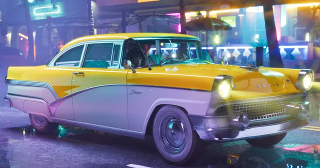 A yellow vintage taxi under Vice City neon